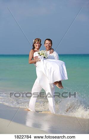 Wedding couple on a tropical beach View Large Photo Image Picture - Wedding couple on a tropical beach. Fotosearch