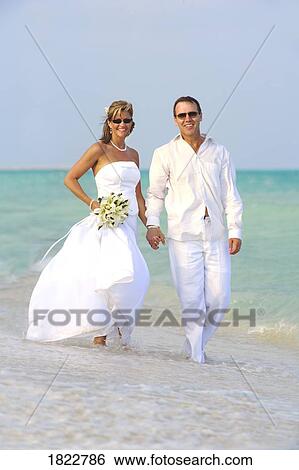 Stock Photograph - Wedding couple on the beach. Fotosearch