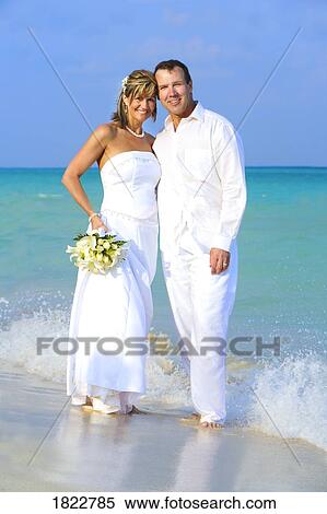 Stock Photography - Wedding couple on the beach. Fotosearch