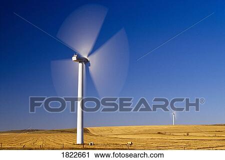 Stock Image - Windmills generating electricity near Pincher Creek, Alberta, Canada. Fotosearch