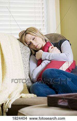 Woman asleep on the couch View Large Photo Image Picture - Woman asleep on the couch. Fotosearch