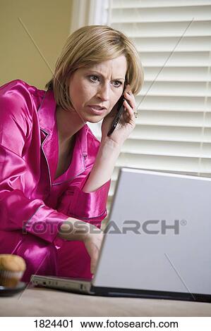 Woman in pajamas, on the phone, and on the computer View Large Photo Image Stock Image - Woman in pajamas, on the phone, and on the computer. Fotosearch