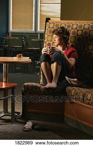 Stock Photo - Woman in restaurant. Fotosearch