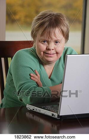 Stock Image - Woman working on a computer. Fotosearch