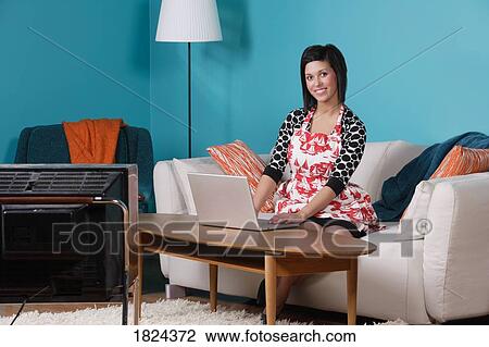 Woman working on lap top computer View Large Photo Image Stock Image - Woman working on lap top computer. Fotosearch