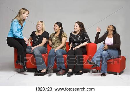 Stock Image - Women laughing together. Fotosearch