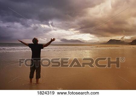 Stock Photo - Worship on a beach. Fotosearch