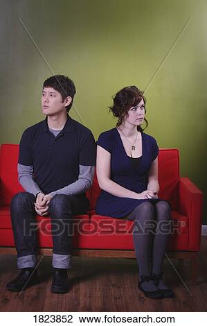 Stock Image - Young couple at odds. Fotosearch