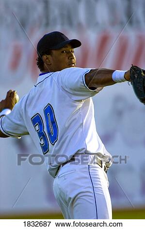 A baseball player about to throw a ball View Large Photo Image Stock Photo - A baseball player about to throw a ball. Fotosearch