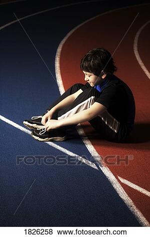 A boy tying his laces View Large Photo Image Stock Photo - A boy tying his laces. Fotosearch