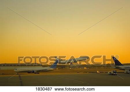 Stock Photo - A commercial airplane taking off . Fotosearch
