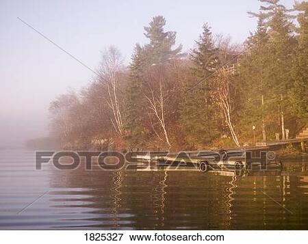 Stock Photo - A dock at a lake. Fotosearch