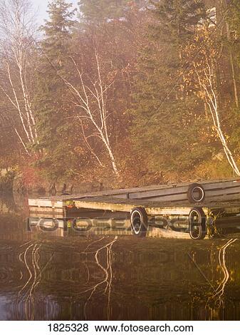 Stock Photo - A dock at a lake. Fotosearch