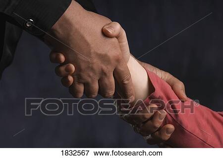 A man helping a woman up View Large Photo Image Stock Photo - A man helping a woman up. Fotosearch