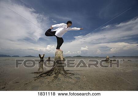 A man stretching on a beach in Koh Lanta, Thailand View Large Photo Image Stock Photo - A man stretching on a beach in Koh Lanta, Thailand. Fotosearch