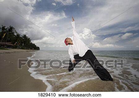 A man with arms outstretched on a beach in Koh Lanta, Thailand View Large Photo Image Stock Image - A man with arms outstretched on a beach in Koh Lanta, Thailand. Fotosearch