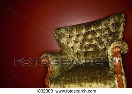 Stock Photo - A Vintage Olive Armchair. Fotosearch