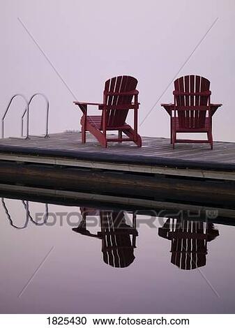 Stock Image - Adirondack Chairs, Lake of the Woods, Ontario, Canada. Fotosearch