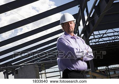 Architect on construction site View Large Photo Image Stock Image - Architect on construction site. Fotosearch