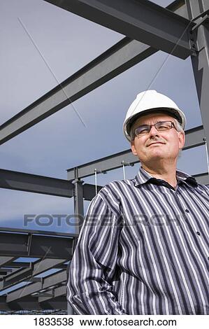 Architect on construction site View Large Photo Image Stock Photo - Architect on construction site. Fotosearch