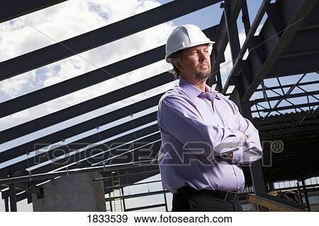 Stock Photo - Architect on construction site. Fotosearch
