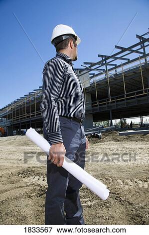 Stock Photo - Architect overlooking building site. Fotosearch