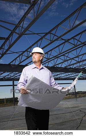 Architect with blueprints View Large Photo Image Stock Image - Architect with blueprints. Fotosearch