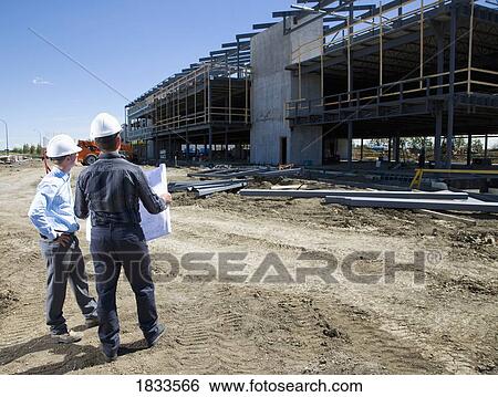 Stock Photograph - Architects overlooking building site. Fotosearch