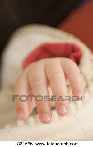 Stock Photograph - Baby hand. Fotosearch