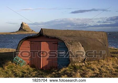 Picture - Barn beside volcanic mound called Beblowe Craig, England. Fotosearch