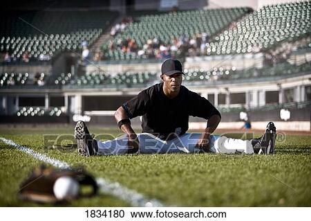 Baseball player stretching View Large Photo Image Stock Image - Baseball player stretching. Fotosearch