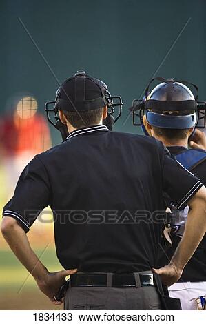 Stock Image - Baseball players watching. Fotosearch