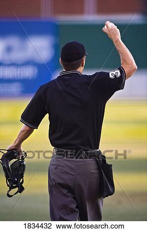 Stock Image - Baseball umpire with mask and ball. Fotosearch