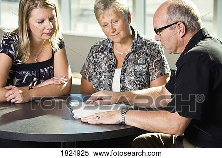Stock Photography - Bible study with three people. Fotosearch