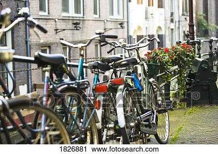 Stock Image - Bicycles, Central Station, Amsterdam, Netherlands . Fotosearch