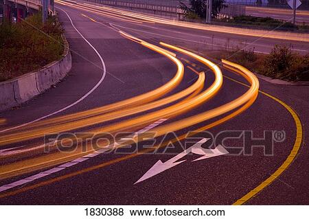 Stock Photo - Blurred headlights on freeway. Fotosearch