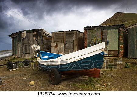Boat beside old shacks View Large Photo Image Picture - Boat beside old shacks. Fotosearch