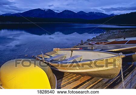 Stock Image - Boats at Patricia lake at Dawn, Jasper National Park, Alberta, Canada. Fotosearch