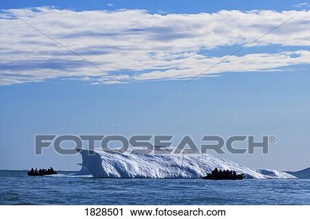 Boats by ice berg off coast of Nunavut, Canada View Large Photo Image Stock Image - Boats by ice berg off coast of Nunavut, Canada. Fotosearch