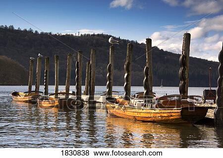 Boats docked on a pier, Keswick, Cumbria, England View Large Photo Image Stock Photo - Boats docked on a pier, Keswick, Cumbria, England. Fotosearch