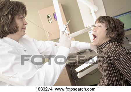 Picture - Boy about to get needle. Fotosearch