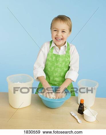 Stock Photo - Boy baking. Fotosearch