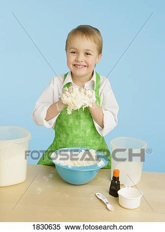 Boy baking View Large Photo Image Stock Photography - Boy baking. Fotosearch