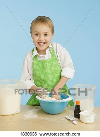 Boy mixing ingredients View Large Photo Image Stock Photograph - Boy mixing ingredients. Fotosearch