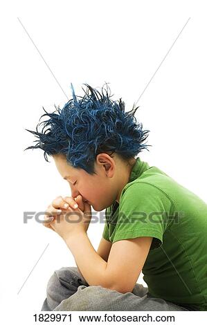 Boy with dyed hair praying View Large Photo Image Stock Image - Boy with dyed hair praying. Fotosearch