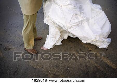 Bride and groom dancing on beach View Large Photo Image Stock Photo - Bride and groom dancing on beach. Fotosearch