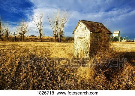 Building in a field View Large Photo Image Stock Photo - Building in a field. Fotosearch