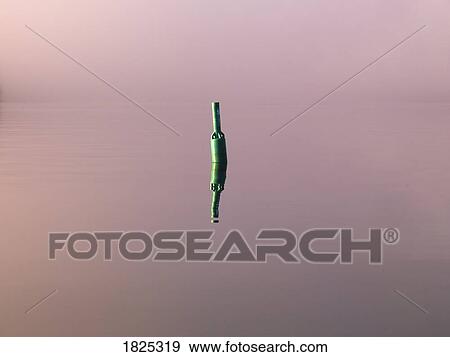 Stock Photo - Buoy in the water. Fotosearch