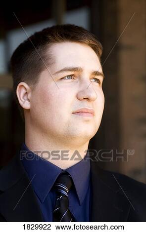 Business man outdoors looking up View Large Photo Image Stock Image - Business man outdoors looking up. Fotosearch
