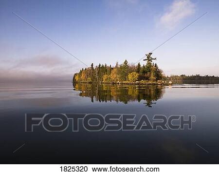 Stock Image - Calm lake water. Fotosearch